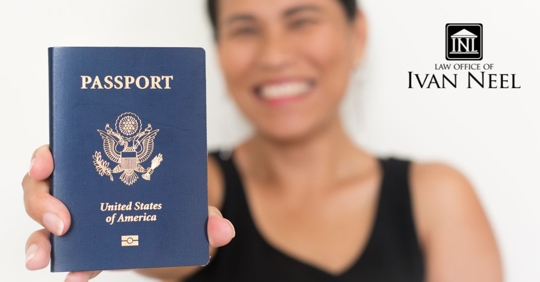 a naturalized US citizen showing off her US passport